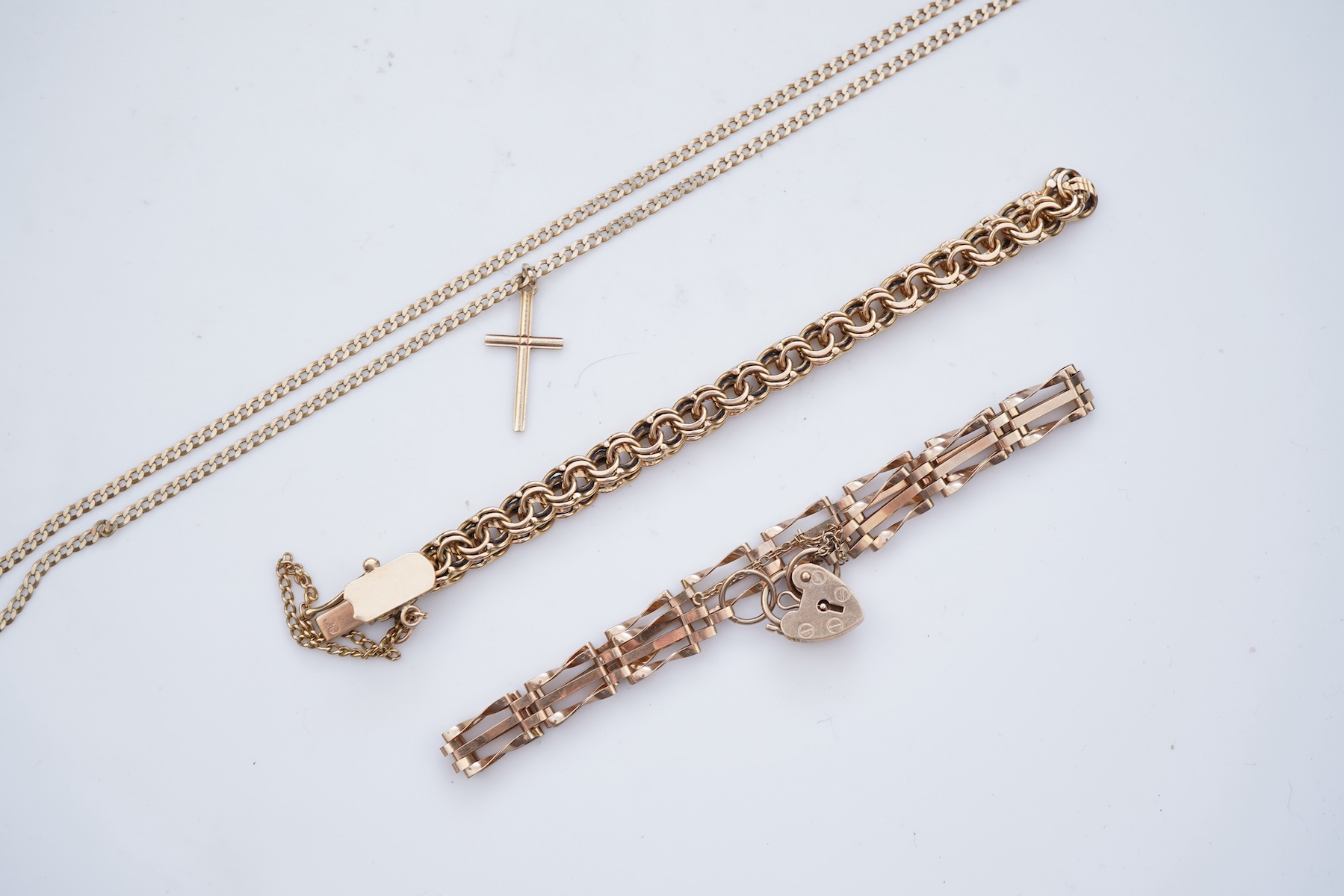 Two gold bracelets and a gold necklace
